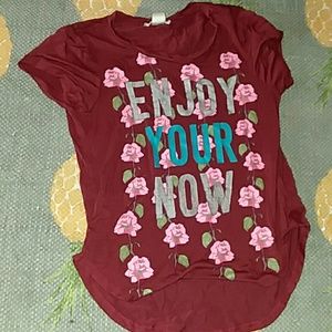 Flowery shirt that says enjoy your now